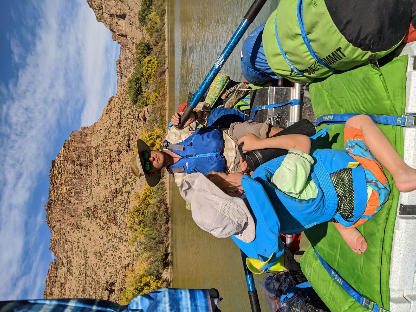 Rowing a loaded raft through a desert canyon